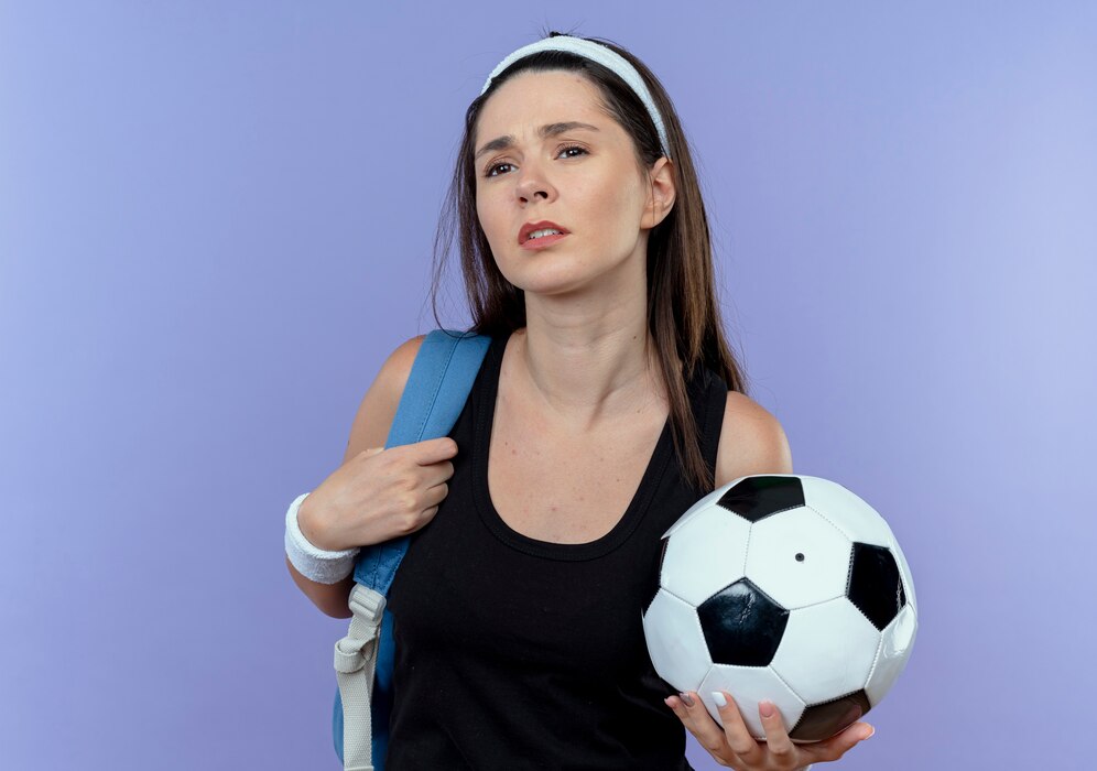 Michelle Smallmon speaking into a microphone during a sports radio show